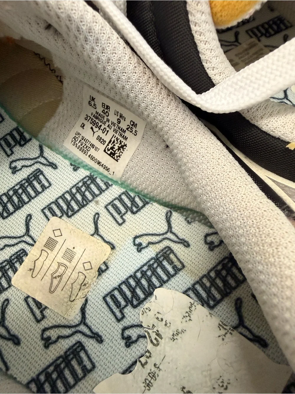 Puma White and Black Retro-Inspired Women's Sneaker with Yellow Accents